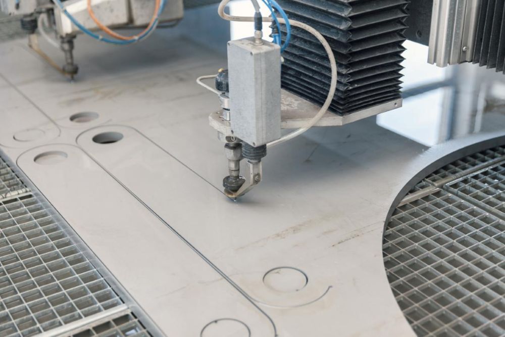 A Machine is Cutting a Piece of Metal With Water — NQBC Pty Ltd in Ayr, QLD