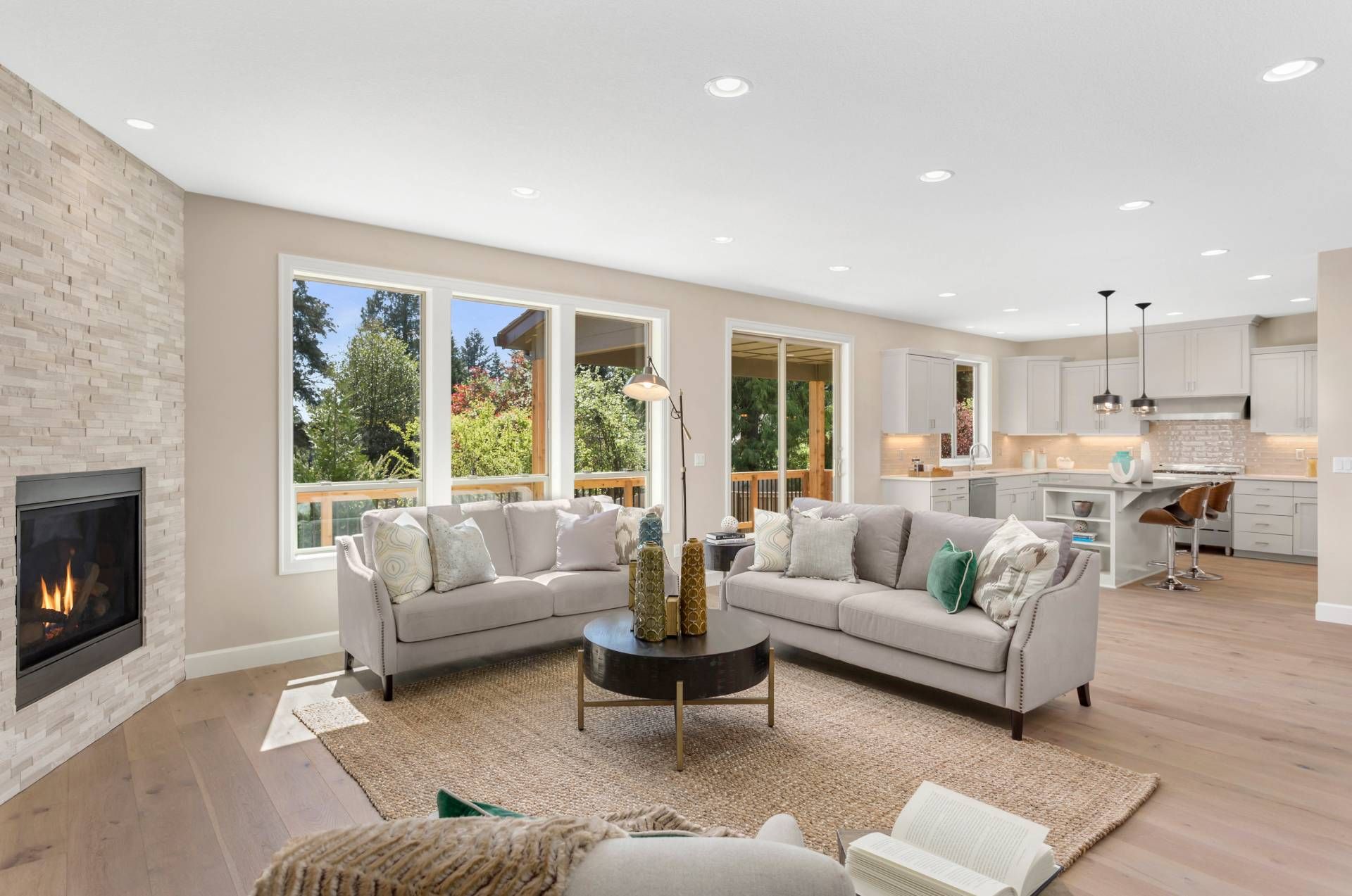 A professionally staged open-concept living room and kitchen near North Fort Myers, FL