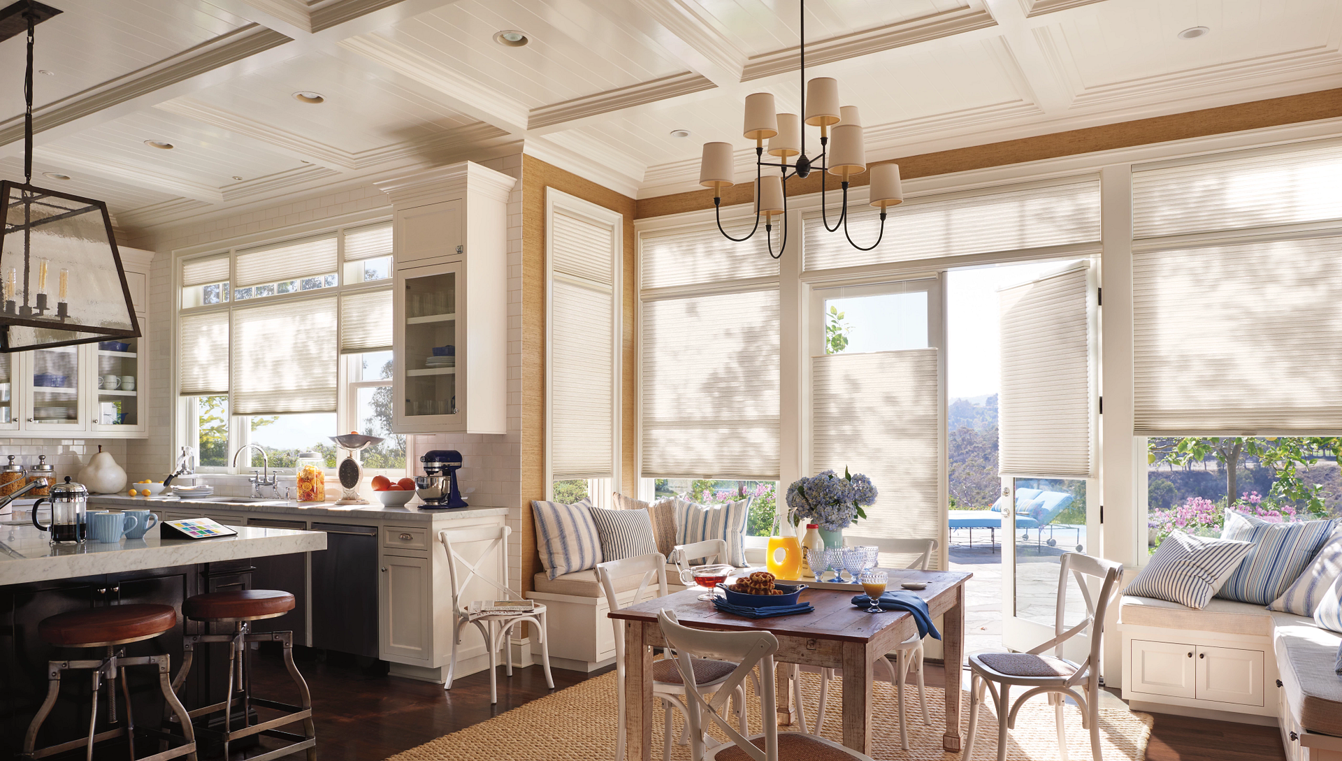 Hunter Douglas Duette® Cellular Shades covering windows in a coastal dining room.