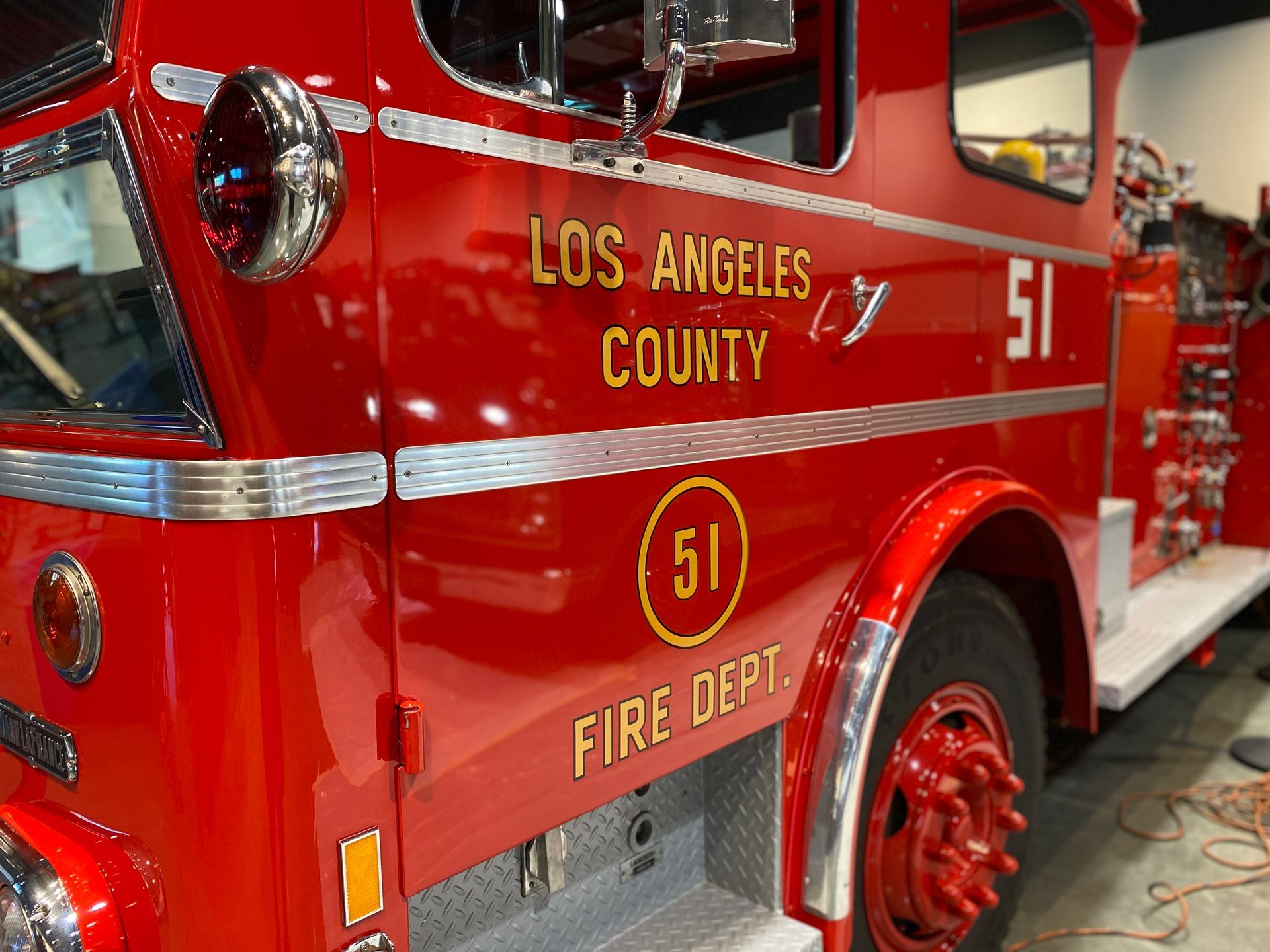 Red Los Angeles County Fire Dept. truck, side view, showing