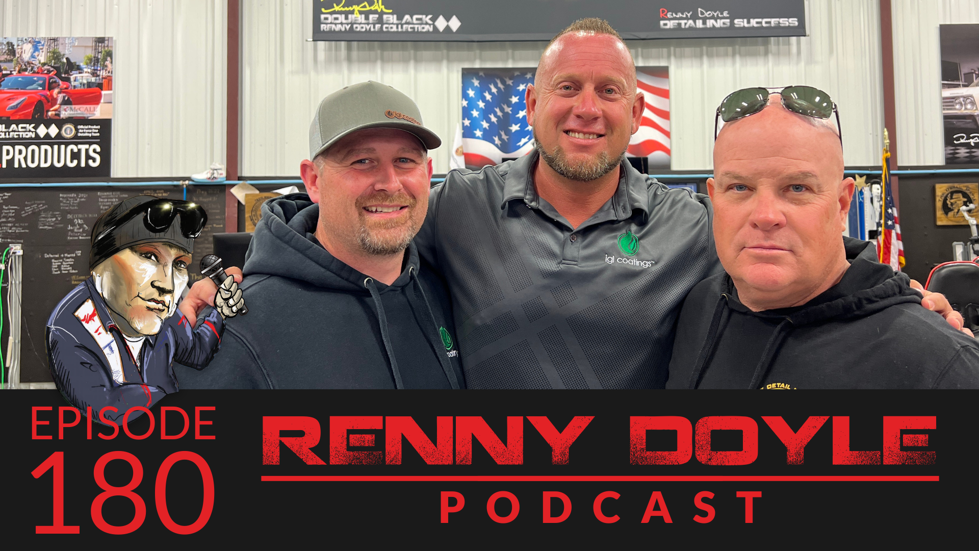 Three men smiling, posing for a photo in a shop with an American flag in the background.