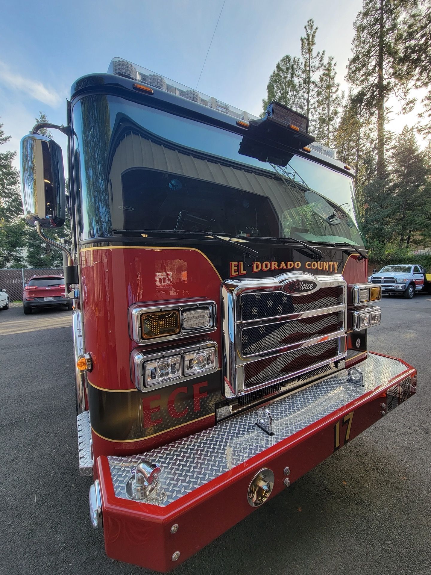 Red and black fire truck with chrome grill, labeled