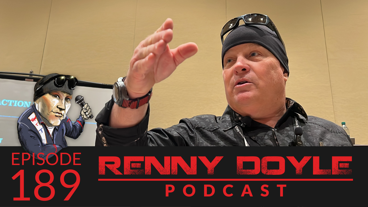 Man in black outfit, sunglasses, and beanie gestures during a podcast. Episode 189: Renny Doyle Podcast.