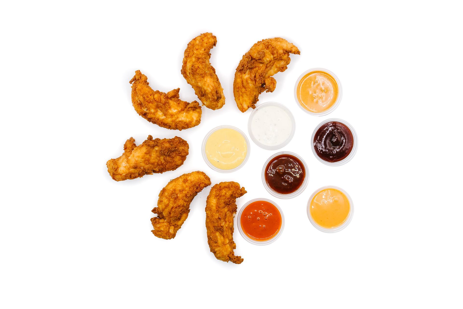 Fried chicken tenders and dipping sauces arranged on a white background.
