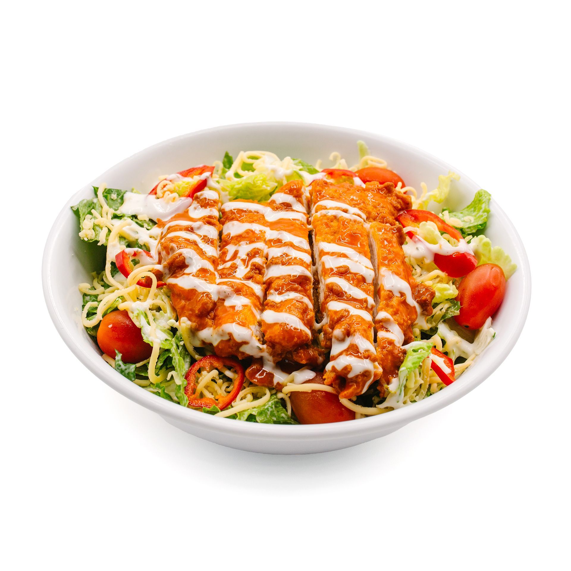 Chicken salad with tomatoes, cheese, and dressing in a white bowl.