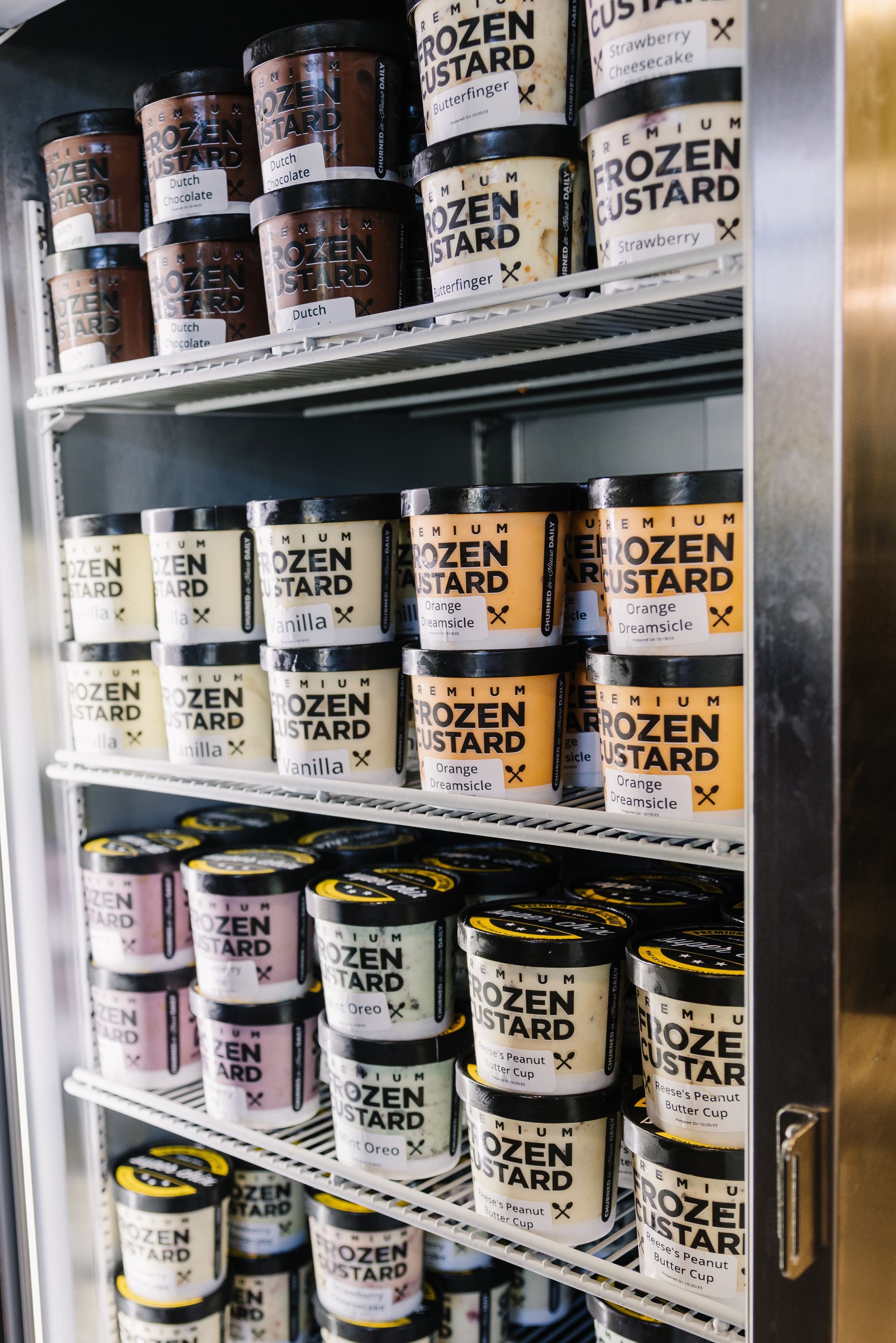 A refrigerator stocked with various flavors of 