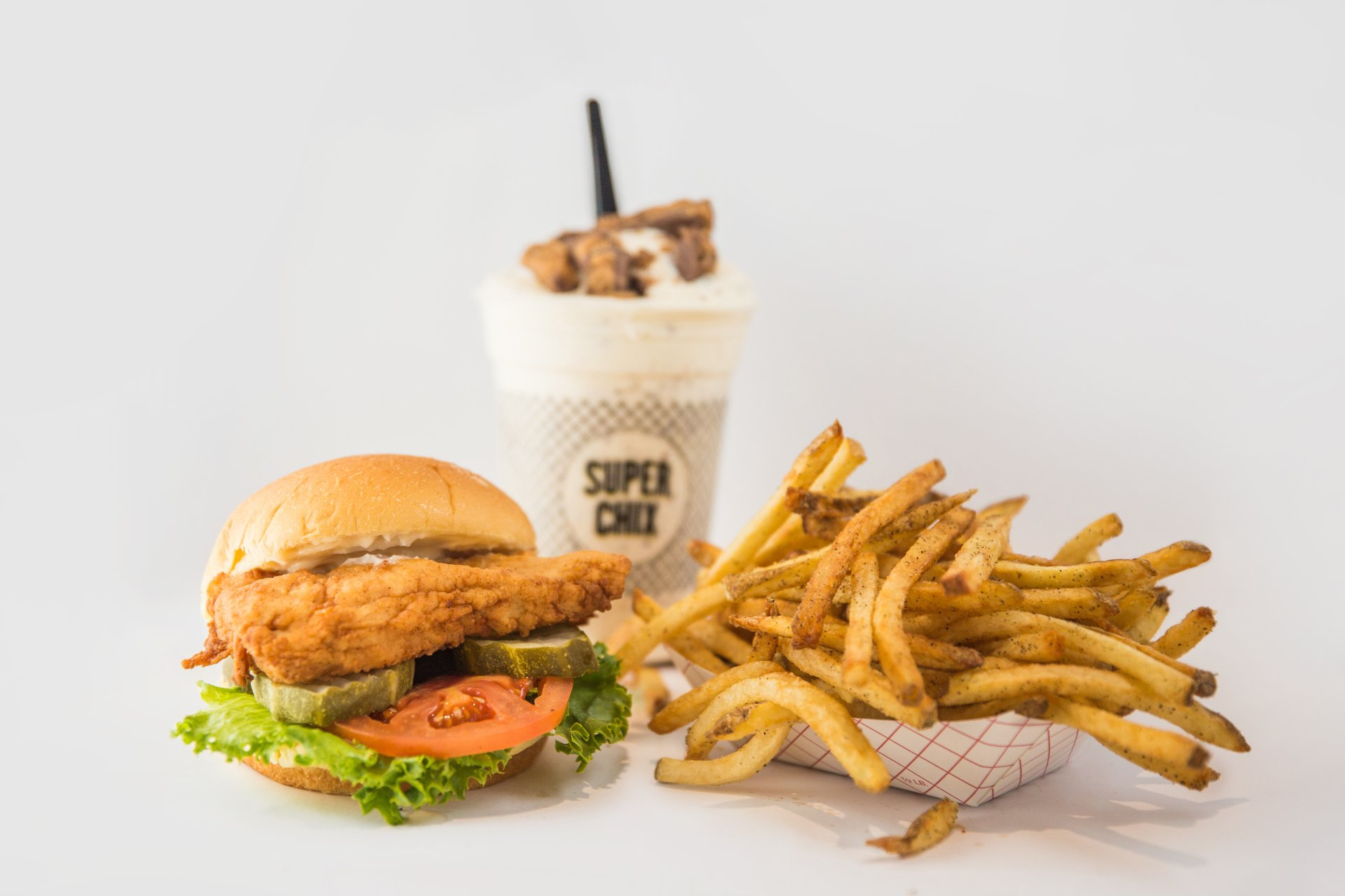 Chicken sandwich, fries, and milkshake from Super Chix restaurant.