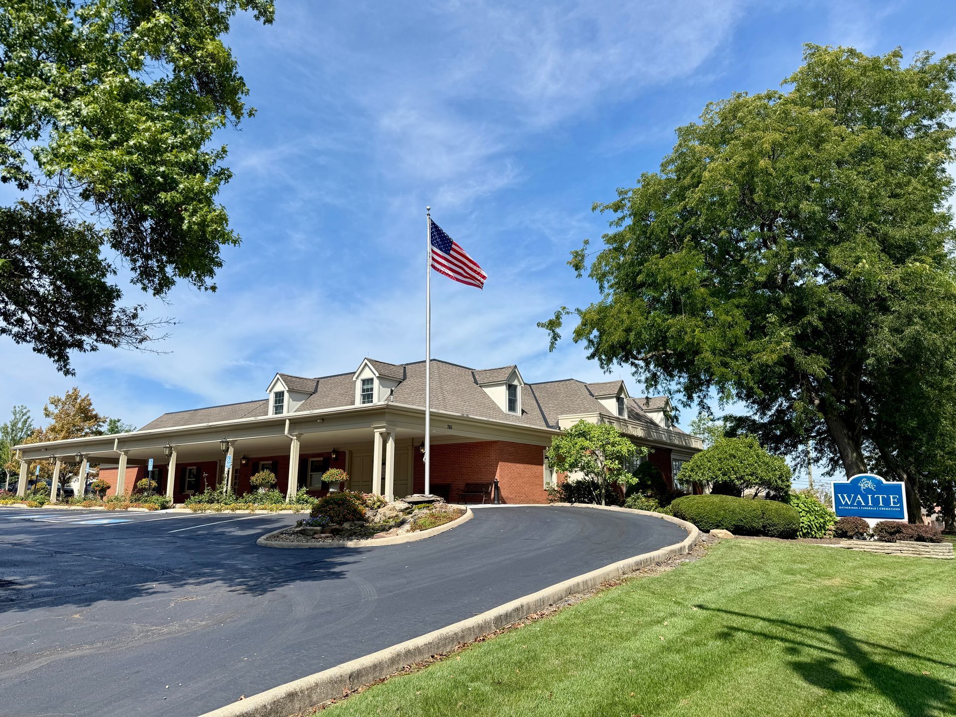 Exterior of Waite Funeral Homes in Medina, Ohio with American flag