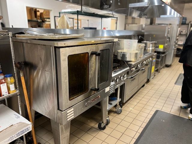 A stainless steel commercial oven repaired and serviced by John's Heating, Cooling, and Appliance Repair
