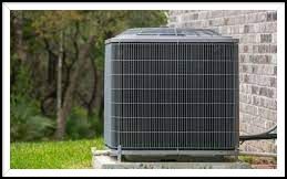 An air conditioner is sitting on the side of a brick house. The air conditioner was installed by John 's Heating, Cooling, and Appliance Repair