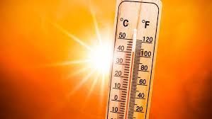 sun shining on a thermometer, taking the temperature