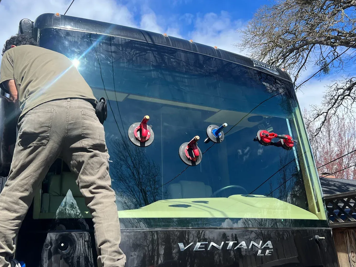 Man installing windshield on a 