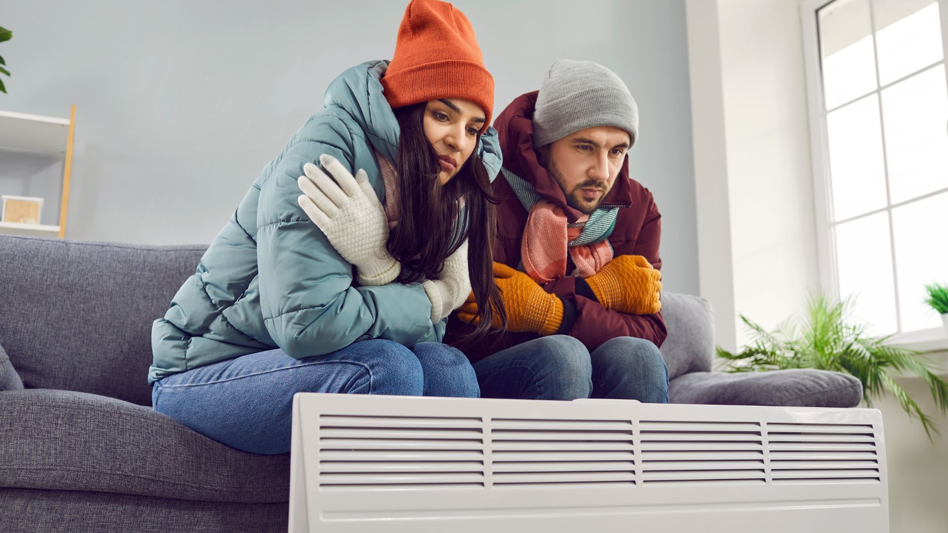couple trying to keep warm indoors