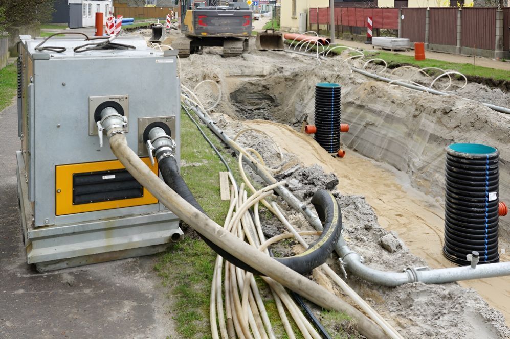A Hose Is Attached To A Box On A Construction Site — Belt Maintenance & Supplies Pty Ltd In Nindaroo, QLD