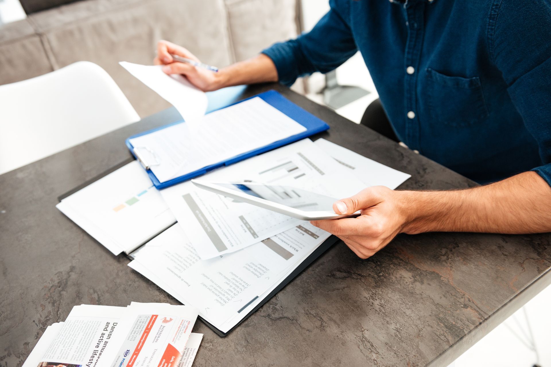 Missouri driver reviewing car insurance documents and comparing coverage options and quotes at home