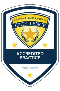 Behavioral Health Center of Excellence Accredited Practice shield logo, blue and gold, 2025-2027