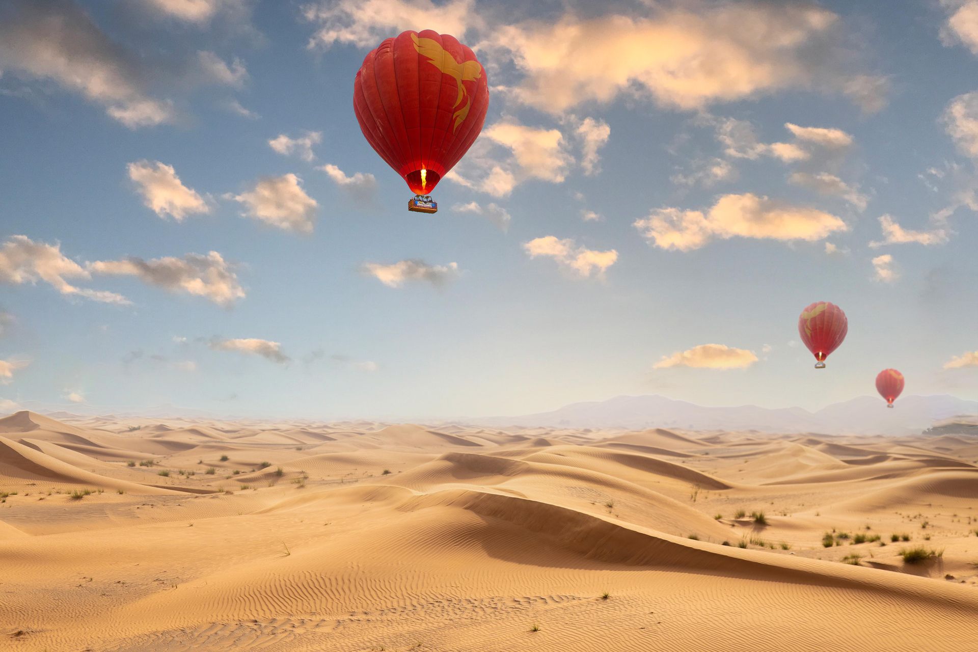 Hot air balloons flying over the desert in Ras Al Khaimah, UAE