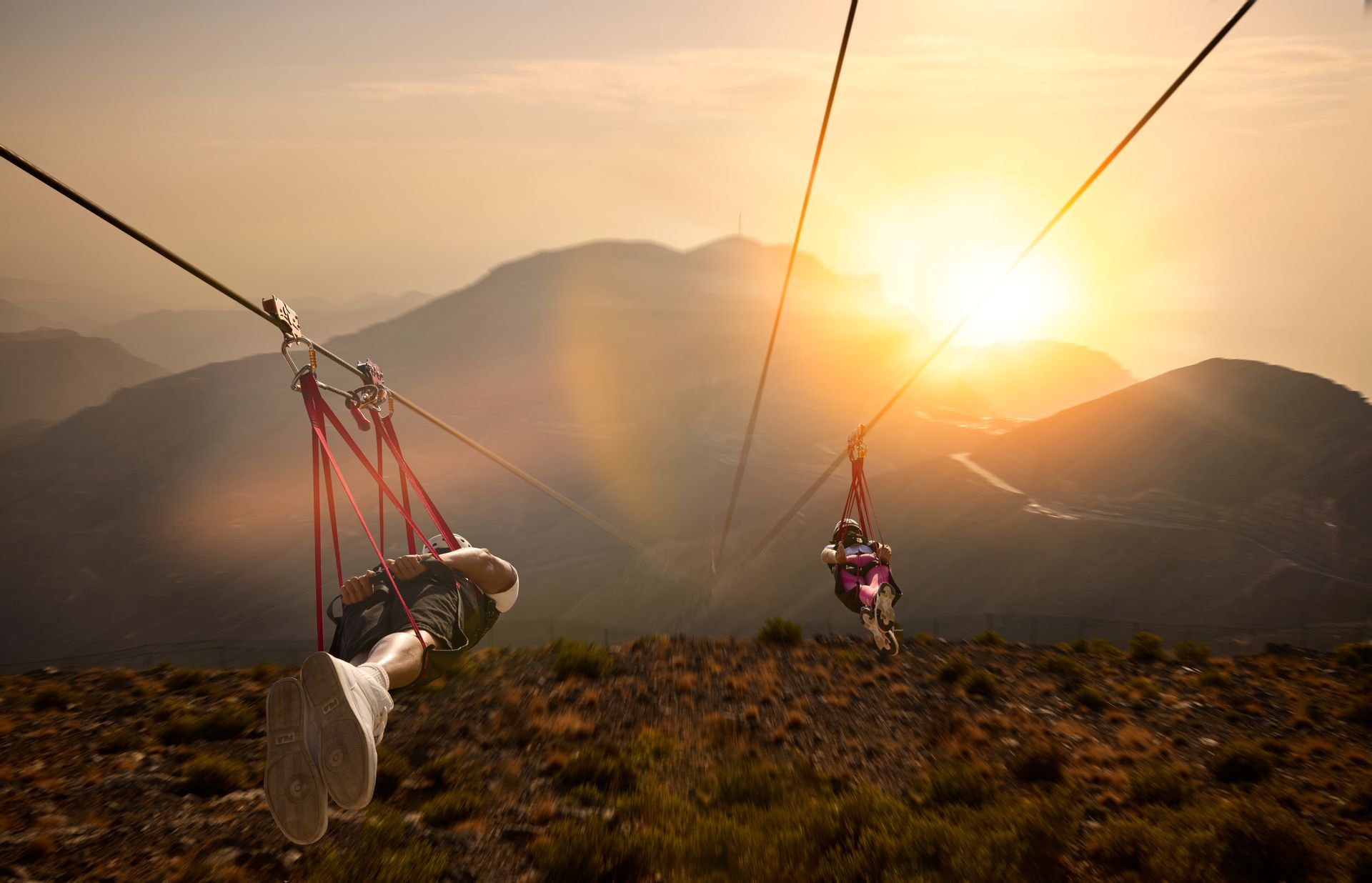 People riding the world's longest zipline, the Jebel Jais Flight in Ras Al Khaimah