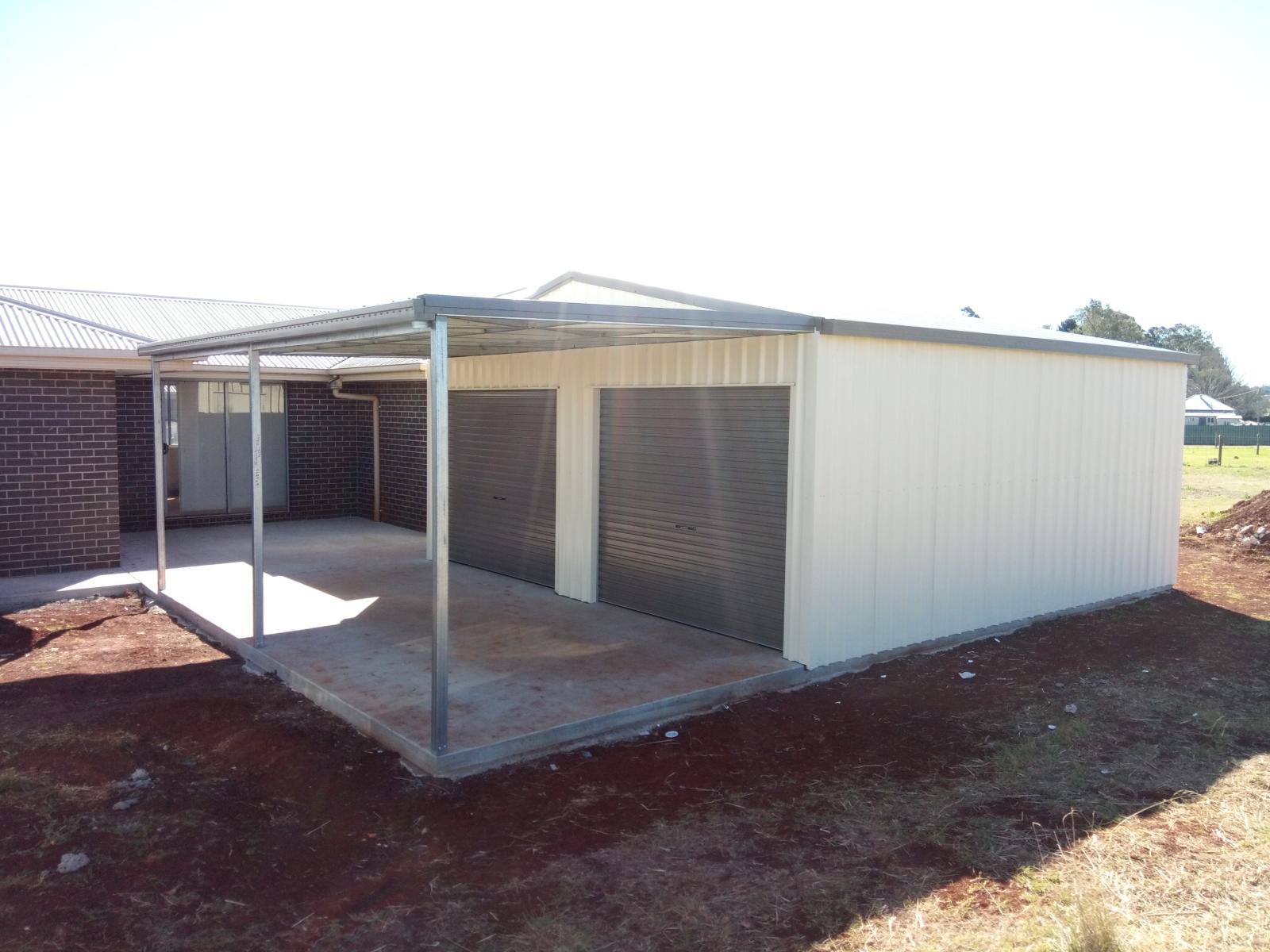 White Shed With Grey Roller Doors - Homes And Sheds Australia Wide