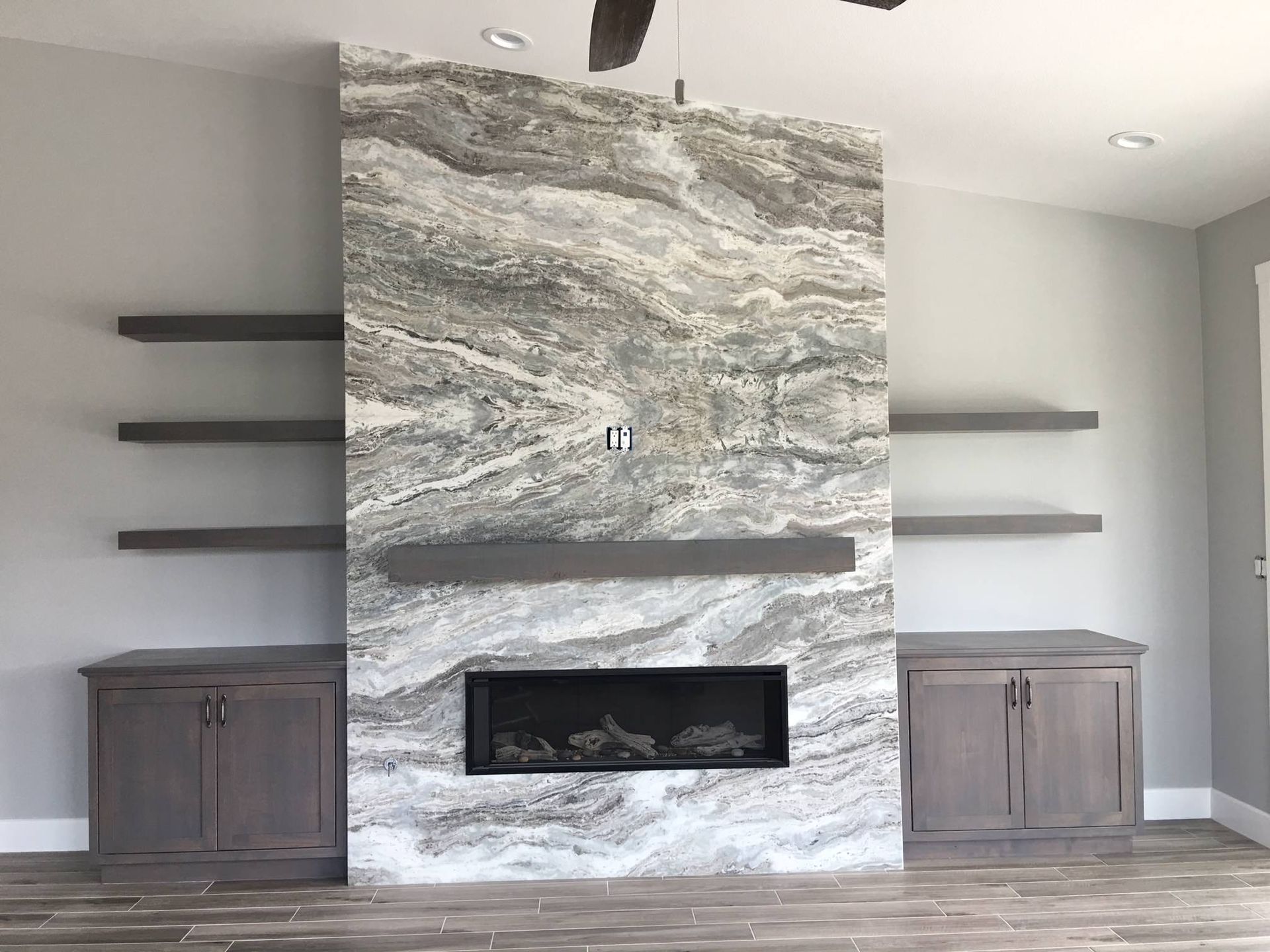 There is a fireplace in the middle of the room.