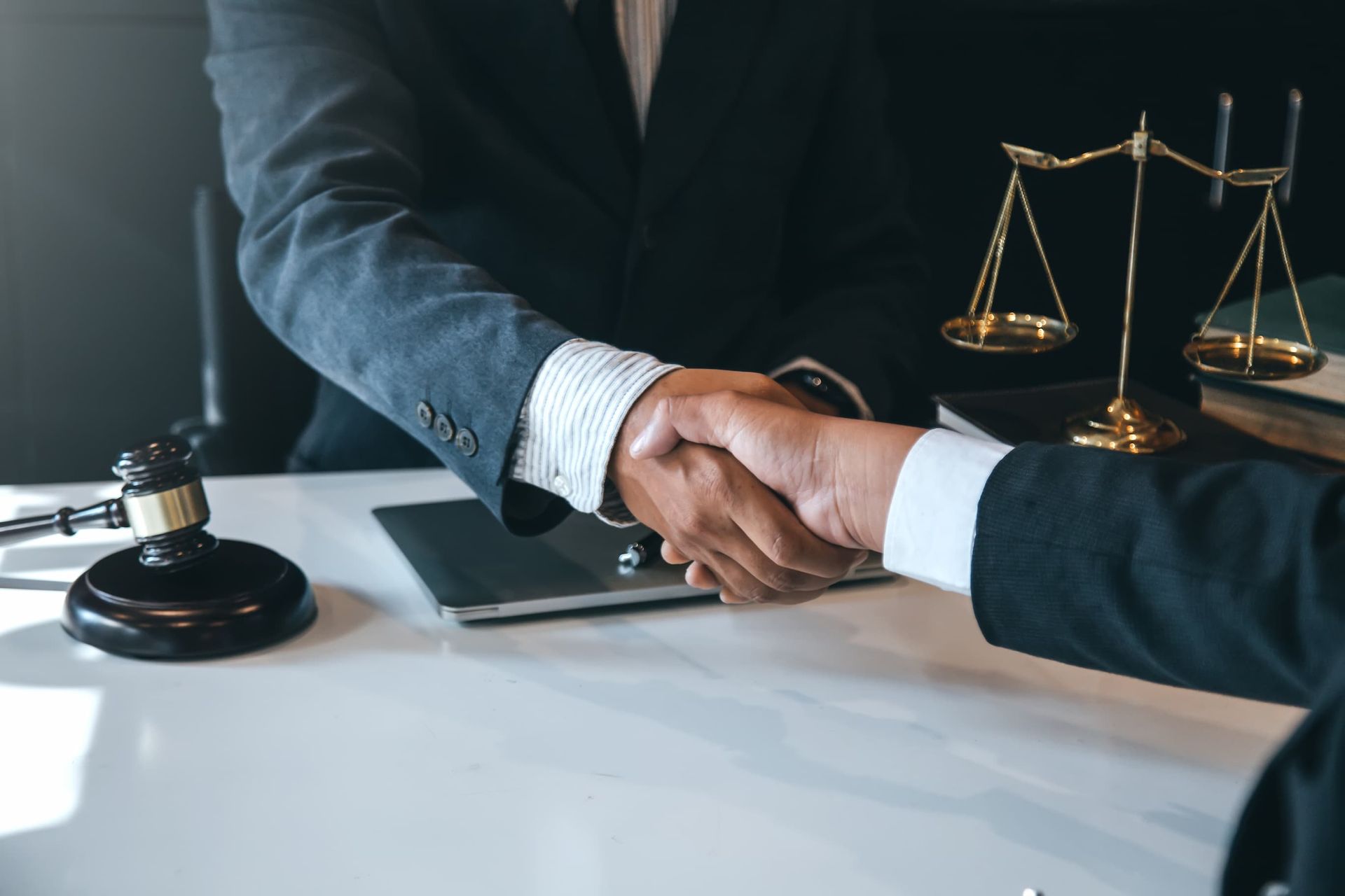 Attorney Shaking Hands for Trust Agreement