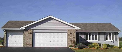 A ranch-style house with a two-car garage and a blue sky background.