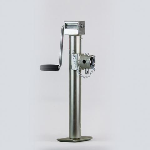 Metal coin-operated parking meter with side crank on a white background