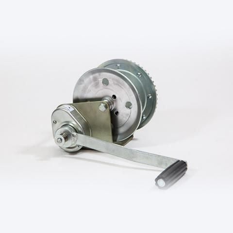 Metal mechanical device with a round housing and long silver lever on a white background