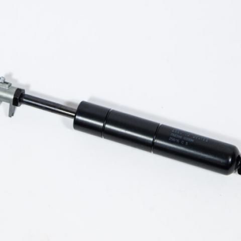 Black gas strut cylinder with silver rod on a white background