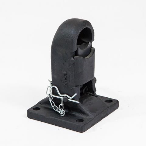 Black metal trailer hitch coupler mounted on a square base with a safety pin attached