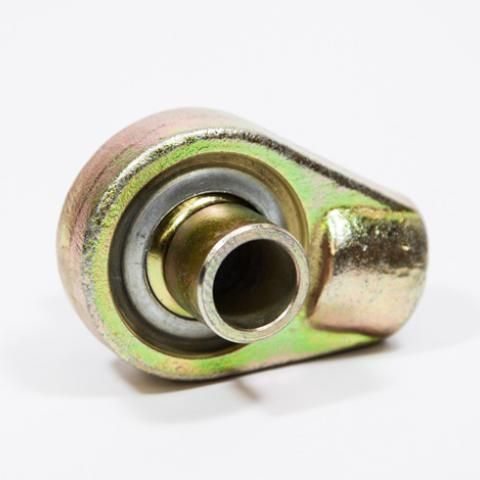 Metal eyelet fitting with a silver ring and brass-colored center on a white background