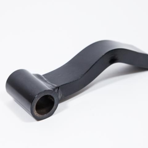 Black metal lever with a cylindrical socket on a white background