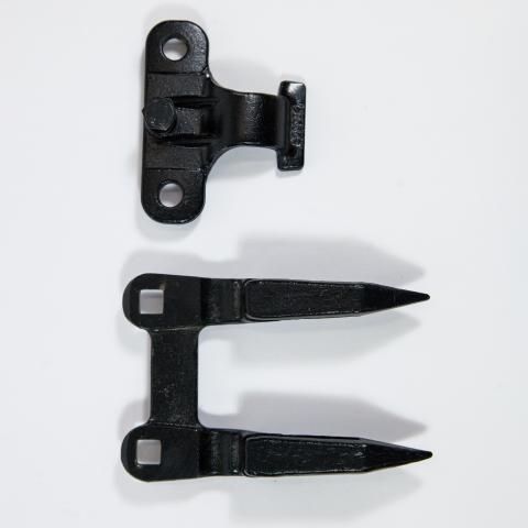 Black metal latch and matching two-prong strike plate on a white background