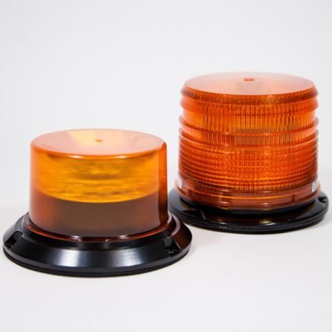 Two amber warning beacons with black bases on a white background