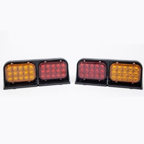 Two black rectangular LED light assemblies with amber and red lenses on a white background