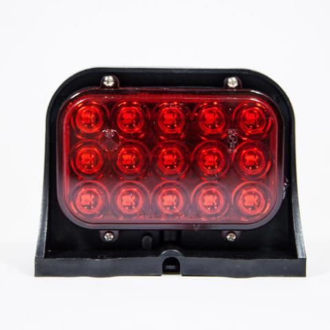 Red LED light cluster with black housing and clear lens on a white background