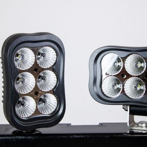 Two black LED light panels with six silver bulbs each on a mounting base, shown on a white background
