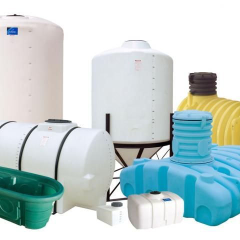 Various plastic storage tanks in white, blue, yellow, and green on a plain background