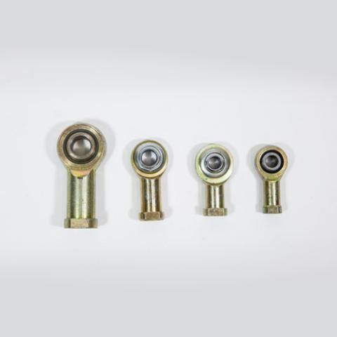 Four metal rod-end bearings of different sizes lined up on a white background