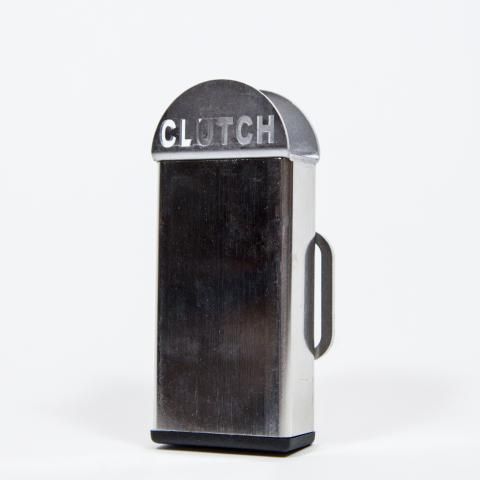 Black and silver metal clutch dispenser with side handle on a white background