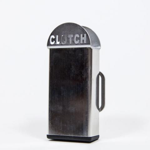 Vintage silver-and-black Clutch lighter with a domed top and side lever on a white background