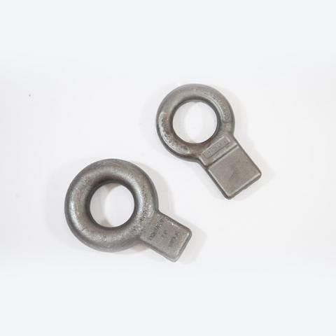 Two metal lug ring terminals on a white background