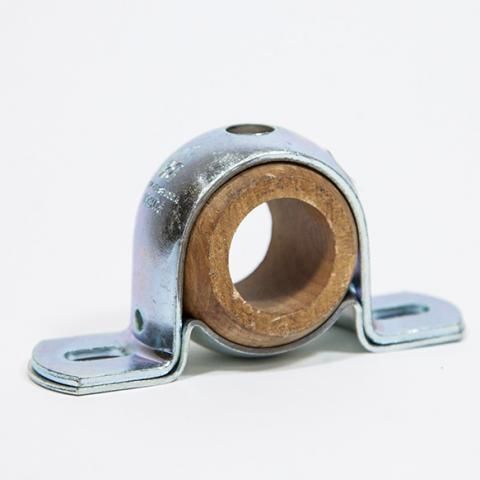 Metal pillow block bearing with a silver housing and bronze inner ring on a white background