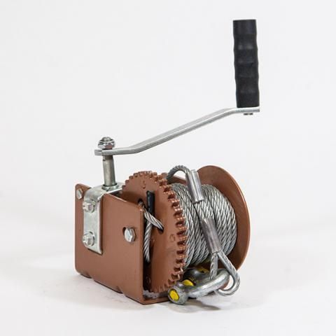 Hand-crank cable reel with brown casing, coiled silver cable, and black handle on a white background