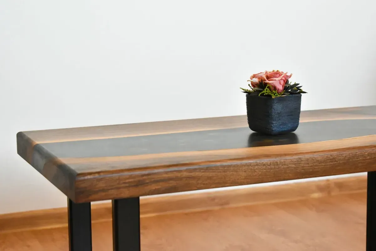 Rustic wooden bookshelf with plants, bowls, and decor in a bright room near a window