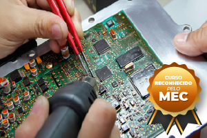 Person repairing circuit board with tools;