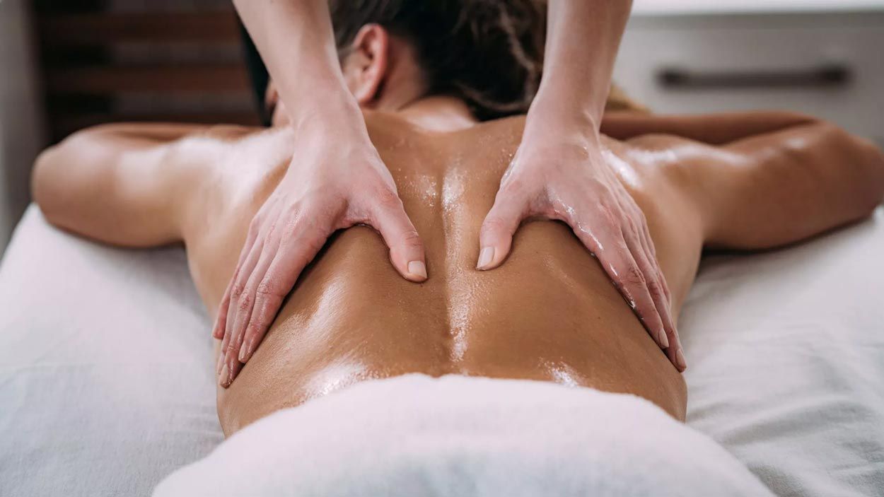 A man is getting a massage at a spa.