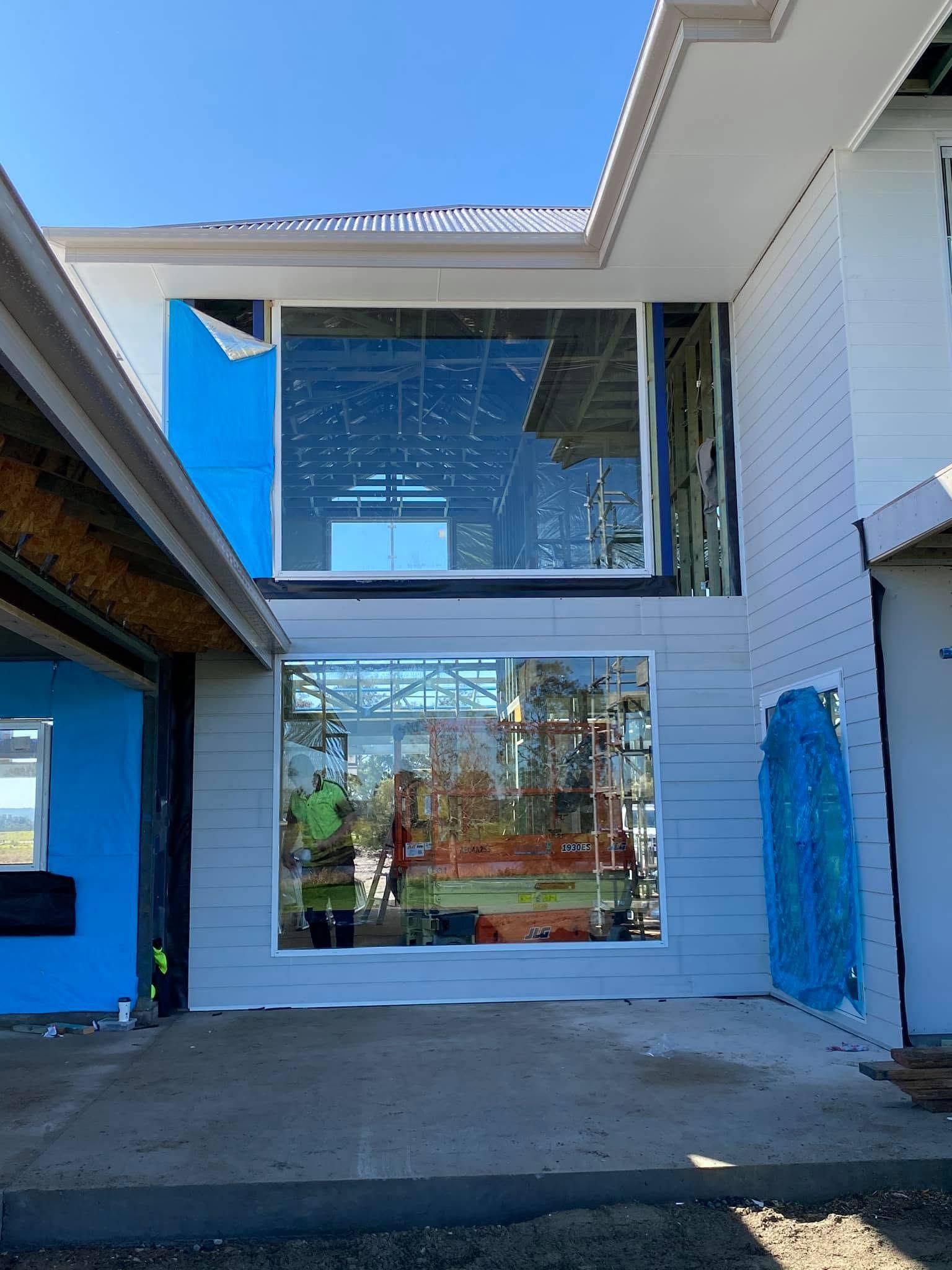 Modern White House Courtyard With Large Windows — Master Glass & Glazing in Newcastle, NSW