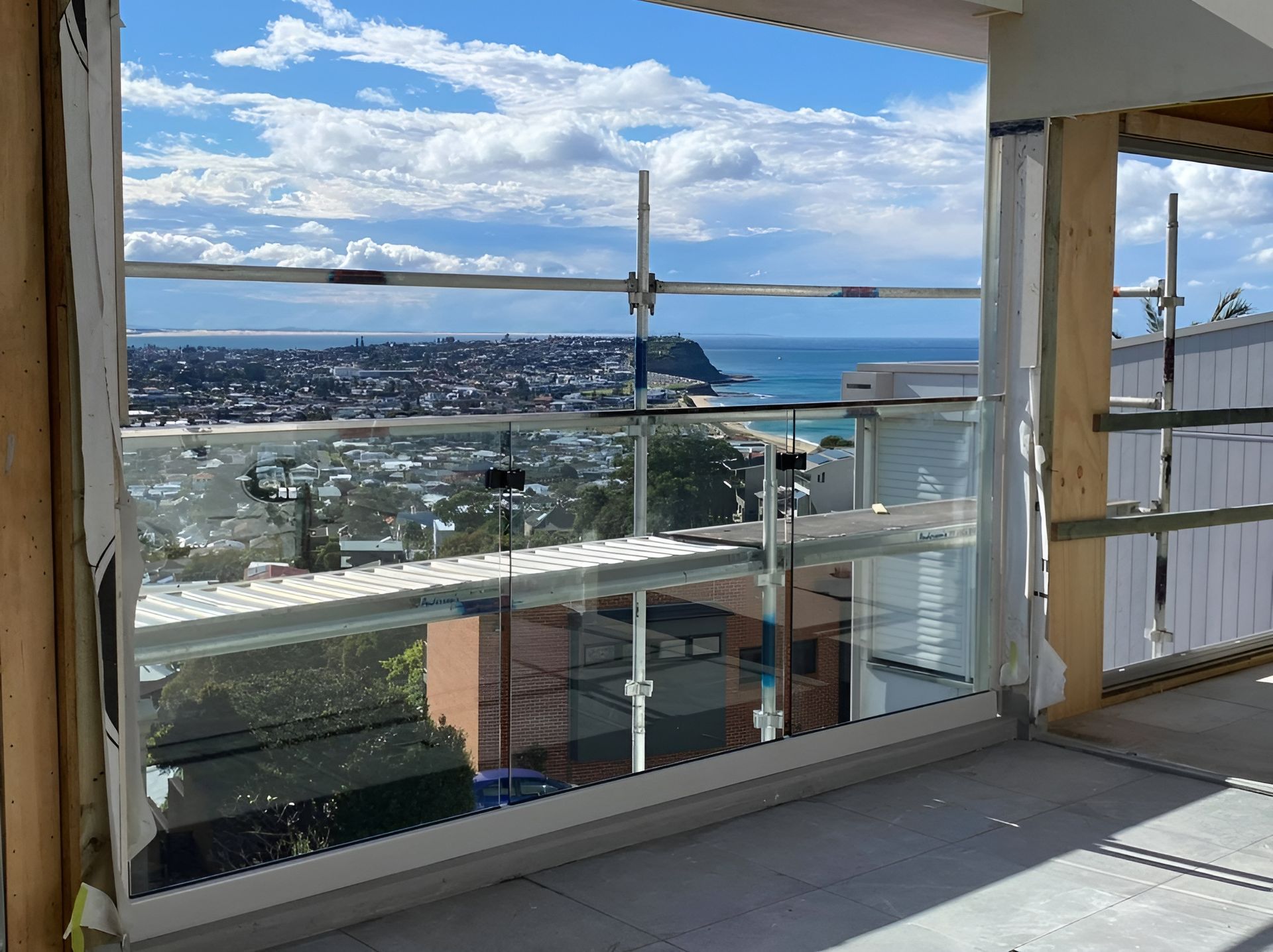 Balcony Under Construction with Glass Railings — Master Glass & Glazing in Warners Bay, NSW