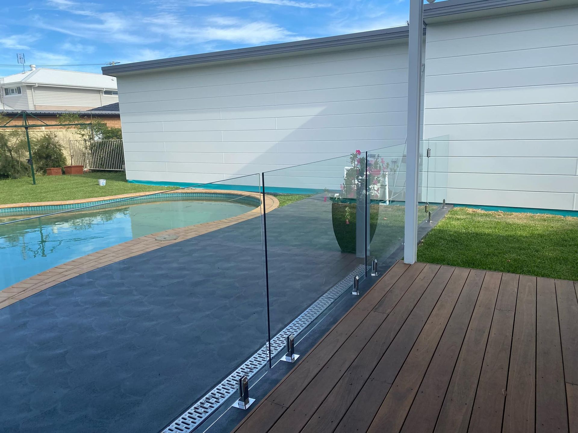 Glass Pool Fence on A Deck and Patio — Master Glass & Glazing in Merewether, NSW